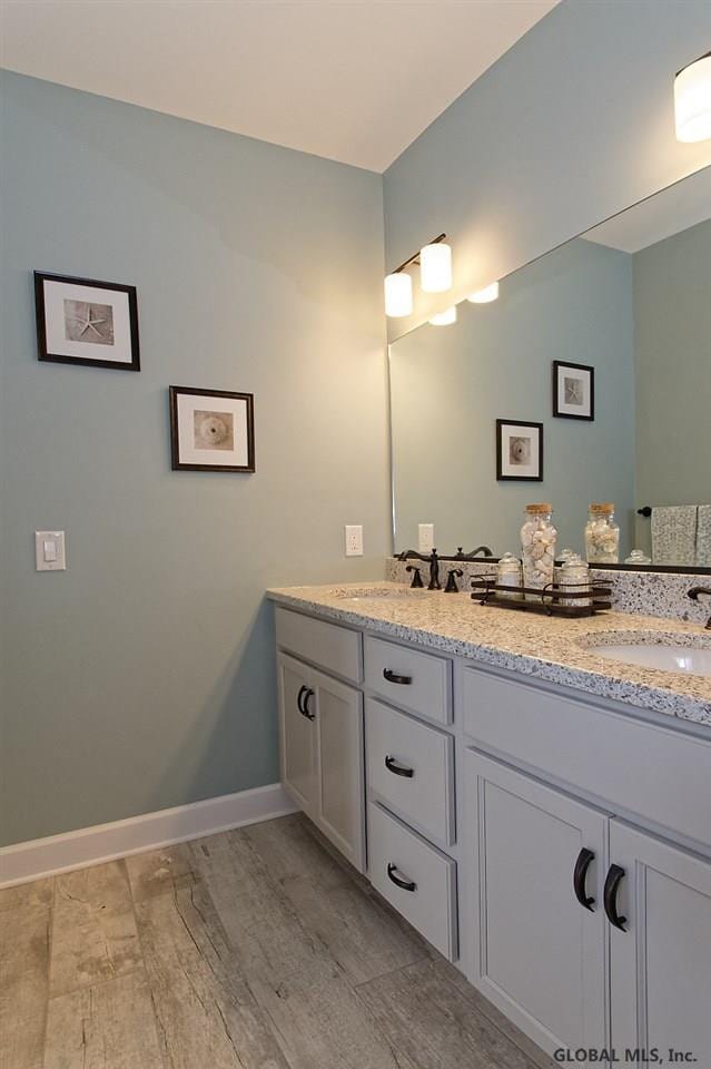1E Brison St, North Greenbush, NY 12180 - full bath with double vanity and wood finished floors