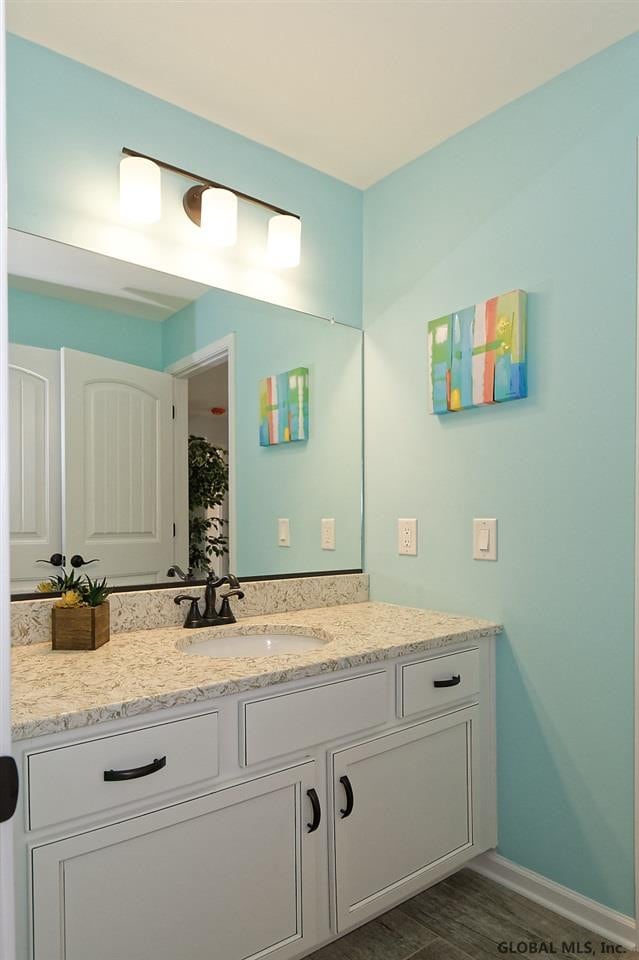 1E Brison St, North Greenbush, NY 12180 - full bath featuring vanity and wood finished floors