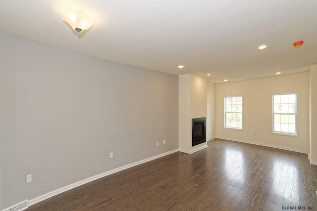 1E Brison St, North Greenbush, NY 12180 - unfurnished living room featuring recessed lighting, dark wood-type flooring, and a glass covered fireplace
