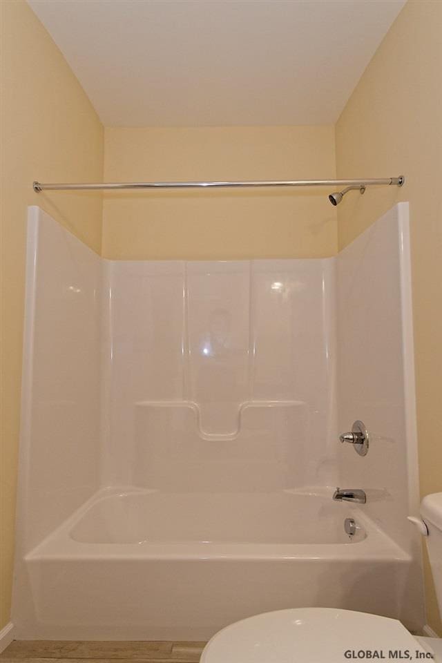 1E Brison St, North Greenbush, NY 12180 - bathroom featuring toilet and tub / shower combination