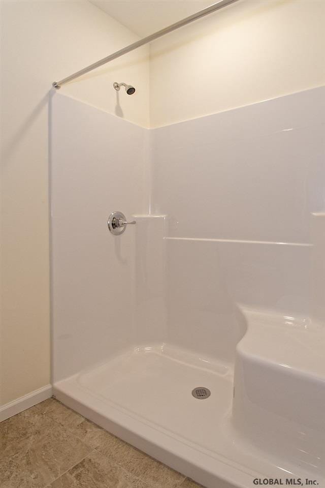1E Brison St, North Greenbush, NY 12180 - full bath with a shower and baseboards