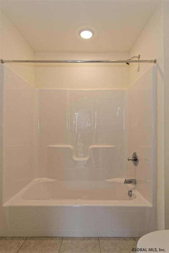 1E Brison St, North Greenbush, NY 12180 - full bathroom with tile patterned floors and bathing tub / shower combination