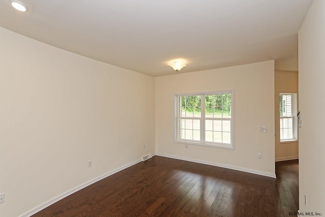 1E Brison St, North Greenbush, NY 12180 - spare room with dark wood-type flooring and baseboards