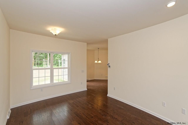 1E Brison St, North Greenbush, NY 12180 - unfurnished room featuring a chandelier and dark wood-style floors