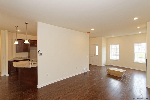 1E Brison St, North Greenbush, NY 12180 - unfurnished living room with dark wood-type flooring and recessed lighting