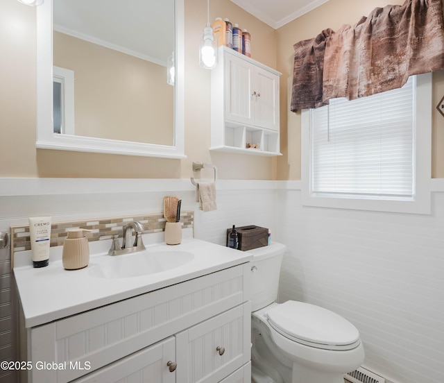 34 Aspen Rd, Colonie, NY 12110 - half bathroom with vanity, crown molding, wainscoting, and tile walls