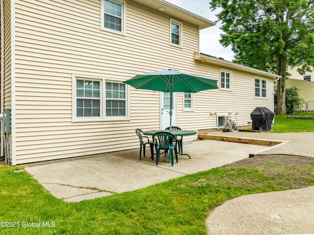 34 Aspen Rd, Colonie, NY 12110 - back of house featuring a patio and a lawn