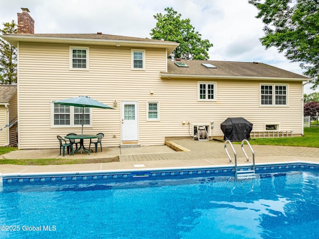 34 Aspen Rd, Colonie, NY 12110 - outdoor pool featuring a grill and a patio area