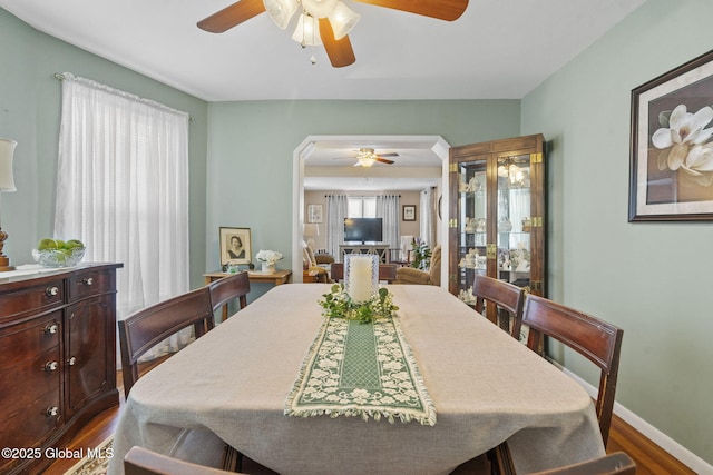 2730 Denver Ave, Rotterdam, NY 12306 - dining space with ceiling fan, dark wood-style flooring, and arched walkways