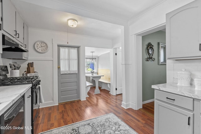 2730 Denver Ave, Rotterdam, NY 12306 - kitchen featuring dishwashing machine, stainless steel gas range oven, dark wood-type flooring, under cabinet range hood, and crown molding