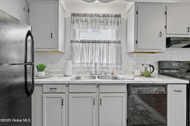 2730 Denver Ave, Rotterdam, NY 12306 - kitchen featuring black appliances, extractor fan, light countertops, and tasteful backsplash