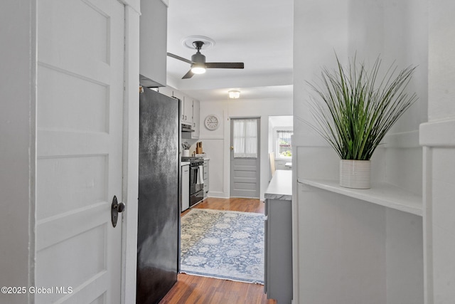 2730 Denver Ave, Rotterdam, NY 12306 - kitchen featuring range with gas stovetop, freestanding refrigerator, wood finished floors, and ceiling fan