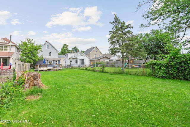 2730 Denver Ave, Rotterdam, NY 12306 - fenced backyard with a deck and a playground