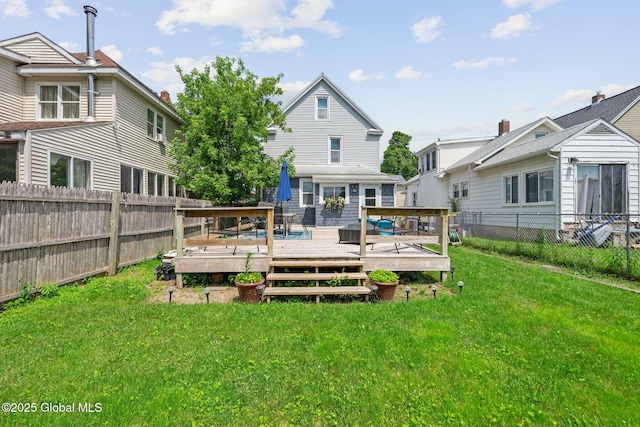 2730 Denver Ave, Rotterdam, NY 12306 - rear view of house with a fenced backyard and a deck