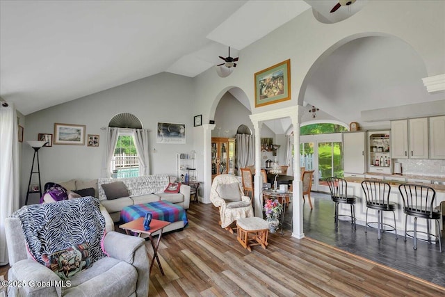 3140 State Route 5s, Danube, NY 13339 - living room featuring arched walkways, a ceiling fan, high vaulted ceiling, and wood finished floors