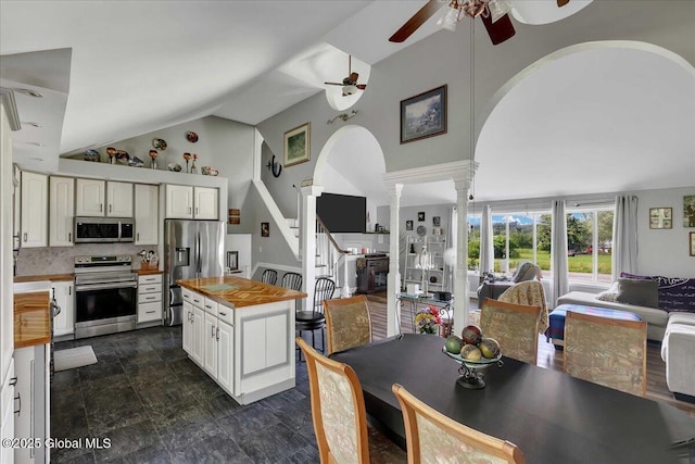 3140 State Route 5s, Danube, NY 13339 - kitchen featuring stainless steel appliances, decorative columns, arched walkways, a ceiling fan, and open floor plan