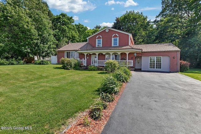 3140 State Route 5s, Danube, NY 13339 - view of front of home featuring covered porch, driveway, and a front lawn