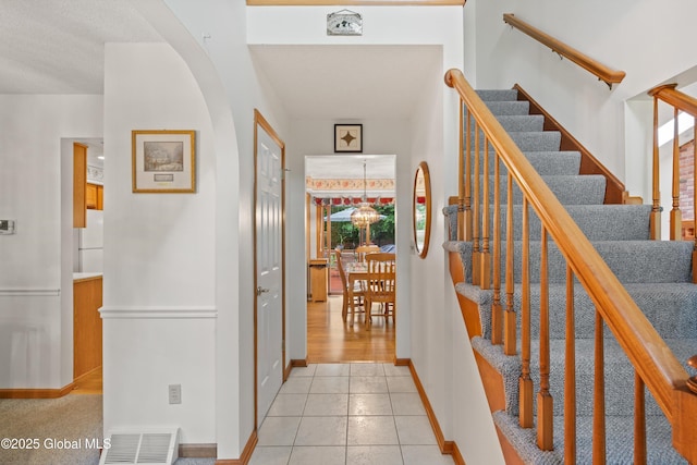 69 Deer Run Holw, Halfmoon, NY 12065 - foyer entrance featuring light tile patterned flooring and stairway