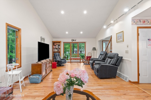 69 Deer Run Holw, Halfmoon, NY 12065 - living room featuring light wood finished floors, recessed lighting, stairs, and high vaulted ceiling