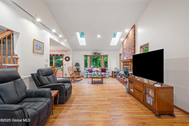 69 Deer Run Holw, Halfmoon, NY 12065 - living room with a skylight, light wood-style flooring, stairway, track lighting, and recessed lighting