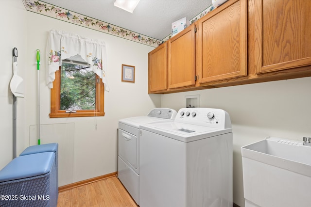69 Deer Run Holw, Halfmoon, NY 12065 - washroom with washer and dryer, cabinet space, and light wood finished floors