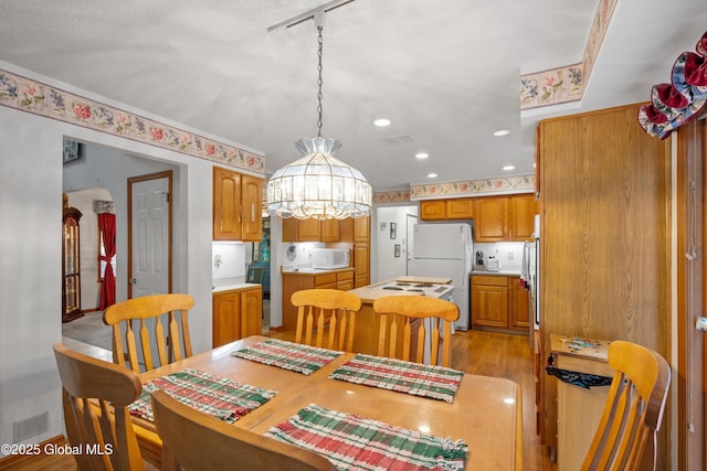 69 Deer Run Holw, Halfmoon, NY 12065 - dining space with light wood-style flooring and recessed lighting