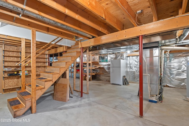 69 Deer Run Holw, Halfmoon, NY 12065 - unfinished below grade area with freestanding refrigerator, stairway, and heating unit