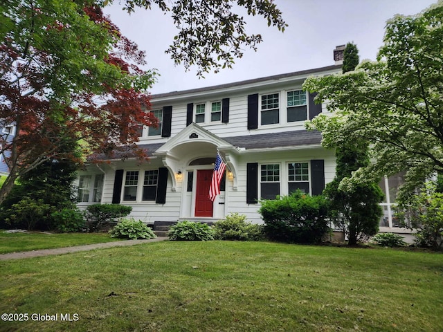 945 Morgan Ave, Niskayuna, NY 12309 - view of front facade featuring a front lawn and a chimney