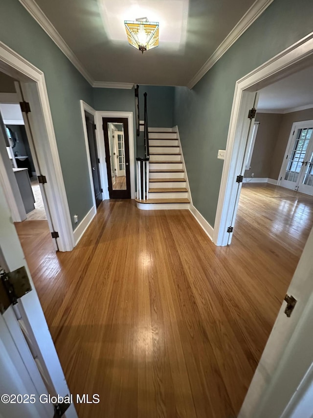 945 Morgan Ave, Niskayuna, NY 12309 - foyer with french doors, wood finished floors, stairway, and ornamental molding