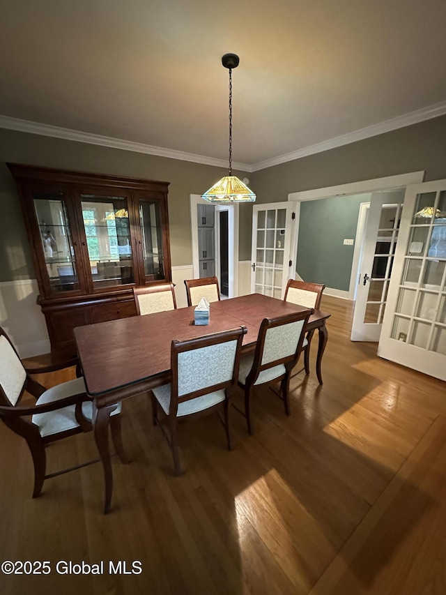 945 Morgan Ave, Niskayuna, NY 12309 - dining area featuring french doors, wood finished floors, and crown molding