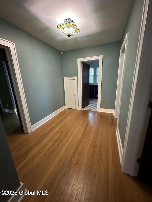 945 Morgan Ave, Niskayuna, NY 12309 - unfurnished dining area with baseboards and wood finished floors