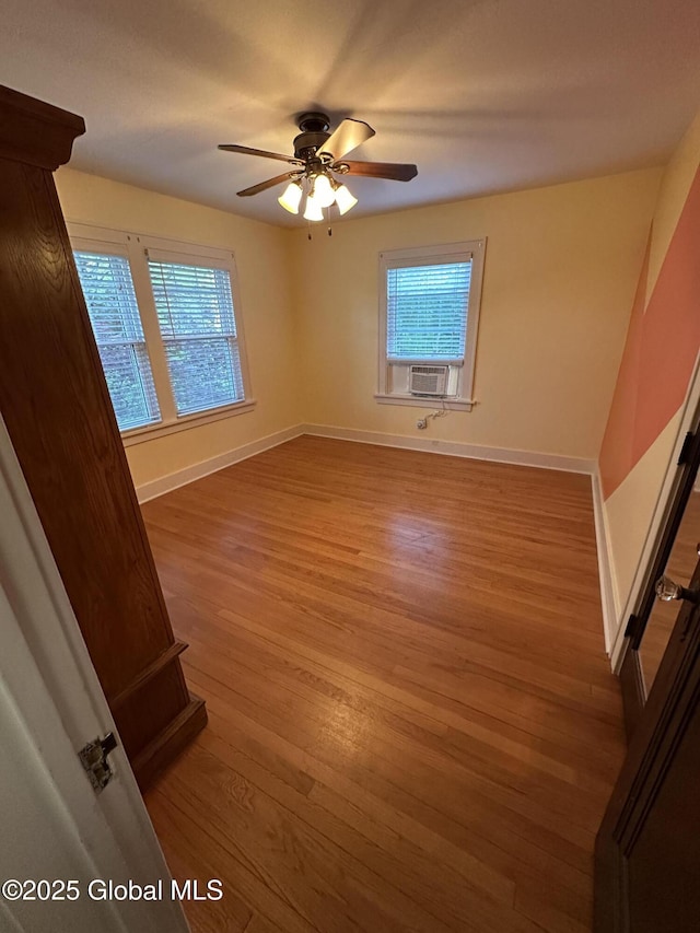 945 Morgan Ave, Niskayuna, NY 12309 - unfurnished room with wood finished floors, plenty of natural light, a ceiling fan, and cooling unit