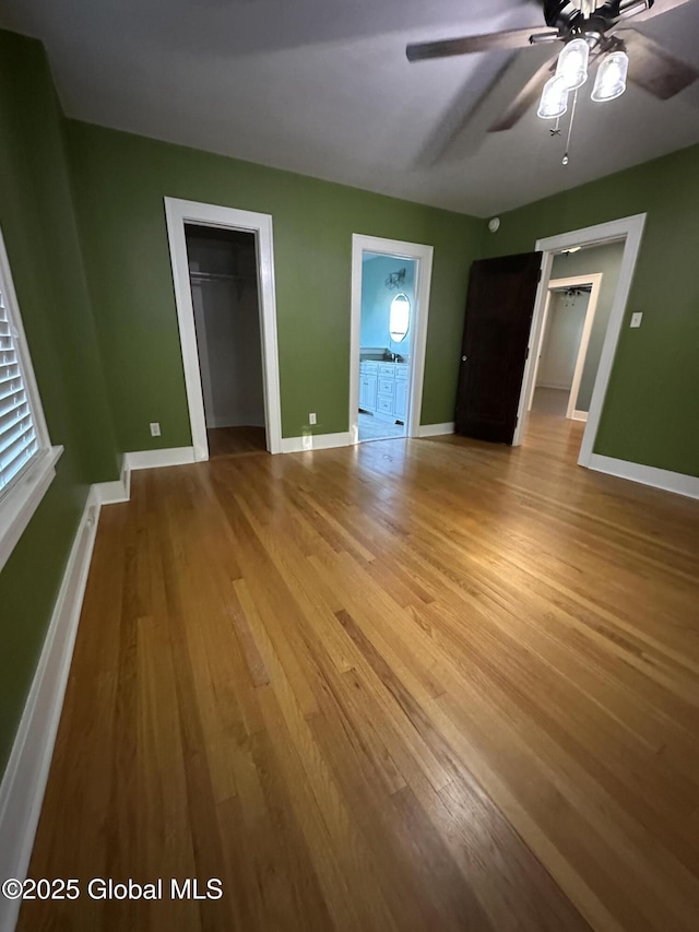 945 Morgan Ave, Niskayuna, NY 12309 - unfurnished bedroom featuring light wood-style flooring, a closet, and a ceiling fan