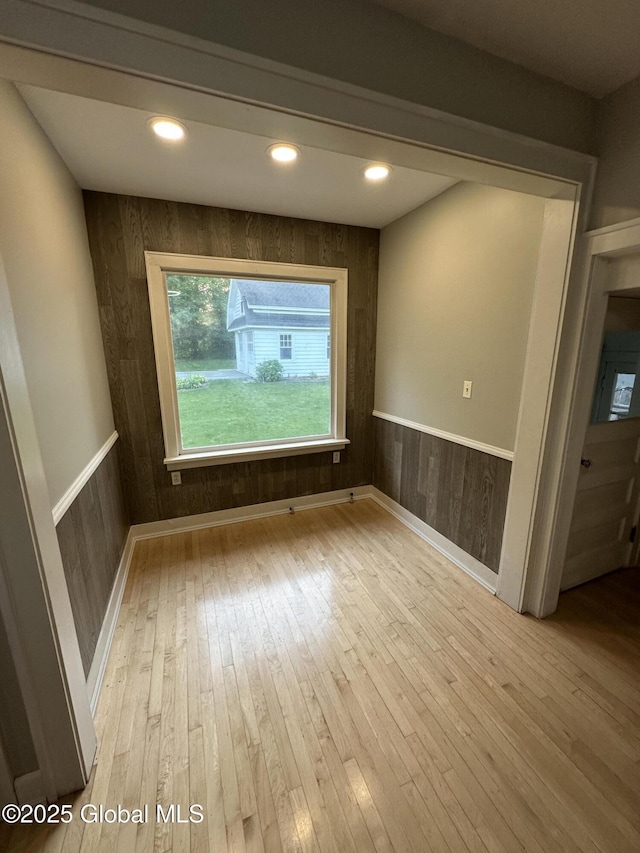 945 Morgan Ave, Niskayuna, NY 12309 - spare room with hardwood / wood-style flooring, wooden walls, wainscoting, and recessed lighting