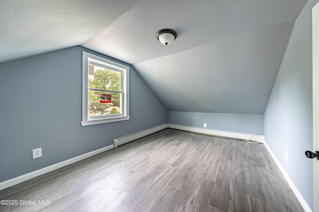 92 Central Ave, Rensselaer, NY 12144 - bonus room with vaulted ceiling, wood finished floors, and baseboard heating