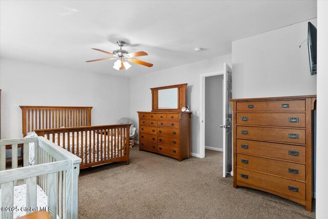 1 Stewart St, Colonie, NY 12205 - carpeted bedroom featuring ceiling fan and a nursery area