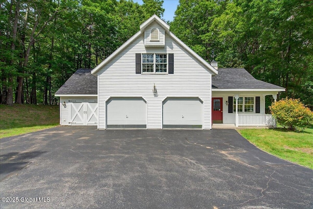 6 Leaward Way, Saratoga Springs, NY 12866 - view of front facade featuring asphalt driveway, a shingled roof, a porch, and view of wooded area