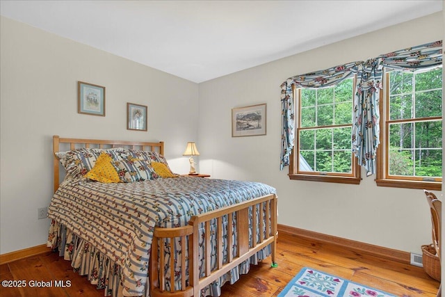 6 Leaward Way, Saratoga Springs, NY 12866 - bedroom with hardwood / wood-style floors and multiple windows