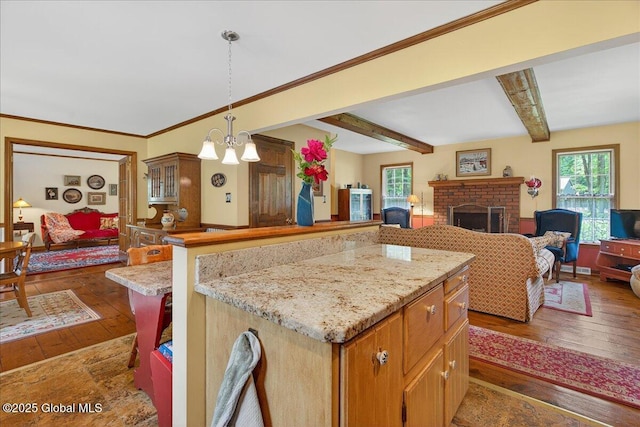 6 Leaward Way, Saratoga Springs, NY 12866 - kitchen featuring hardwood / wood-style floors, open floor plan, a chandelier, and beam ceiling
