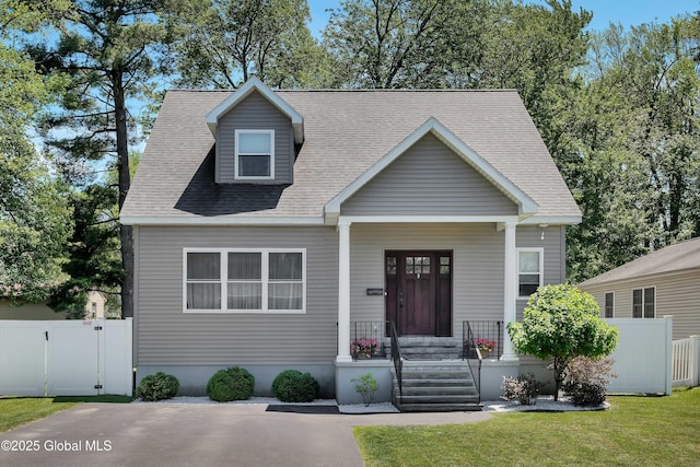 9 Sebring Ave, Colonie, NY 12205 - view of front facade featuring a gate, a shingled roof, and a porch