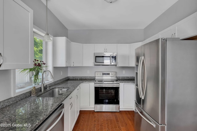 9 Sebring Ave, Colonie, NY 12205 - kitchen featuring appliances with stainless steel finishes, white cabinets, and dark stone counters