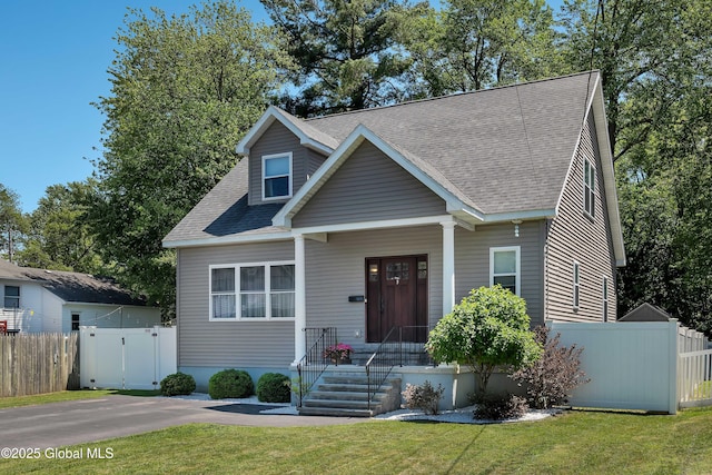 9 Sebring Ave, Colonie, NY 12205 - view of front of home featuring roof with shingles and a gate