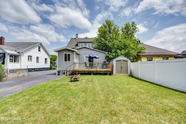 236 Clizbe Ave, Amsterdam, NY 12010 - back of property with a deck, a shed, and a fire pit