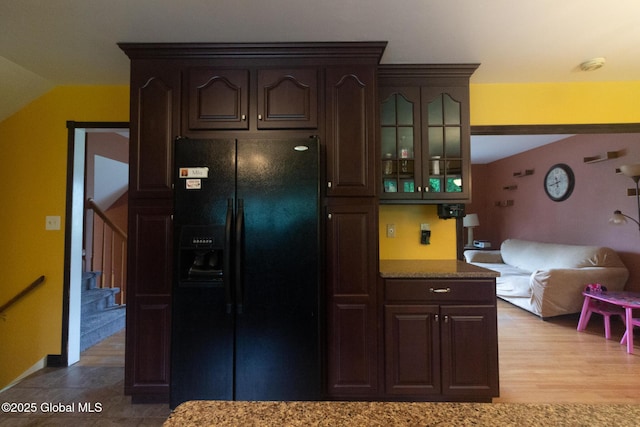 46 Cindy Crest Dr, Rotterdam, NY 12306 - kitchen featuring black fridge, dark brown cabinetry, glass insert cabinets, lofted ceiling, and wood finished floors