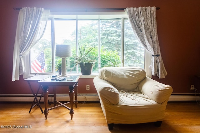 46 Cindy Crest Dr, Rotterdam, NY 12306 - living area with a baseboard heating unit, healthy amount of natural light, light wood-style flooring, and baseboard heating