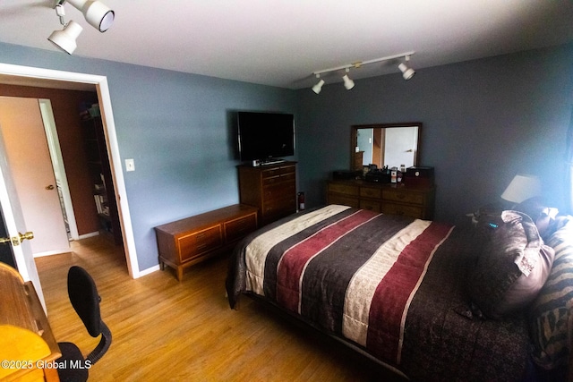 46 Cindy Crest Dr, Rotterdam, NY 12306 - bedroom with light wood-style flooring and rail lighting
