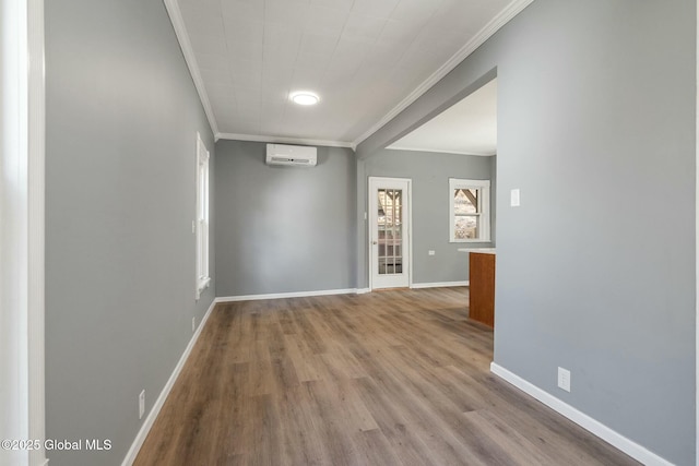 55 Spring Ave, Troy, NY 12180 - empty room with ornamental molding, a wall mounted AC, and wood finished floors