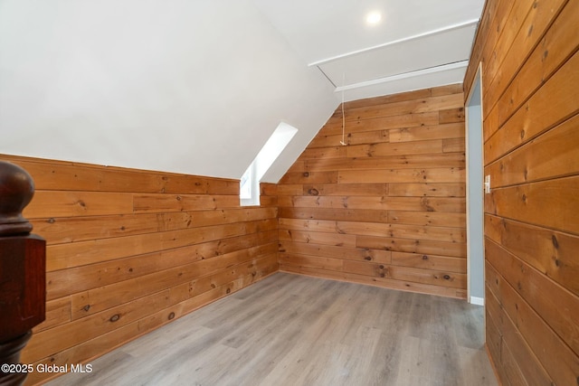 55 Spring Ave, Troy, NY 12180 - additional living space featuring a skylight, wood walls, vaulted ceiling, and wood finished floors