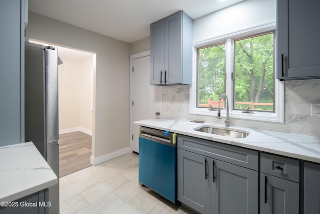 1041 Madison Ave, Troy, NY 12180 - kitchen featuring dishwasher, freestanding refrigerator, tasteful backsplash, and gray cabinets