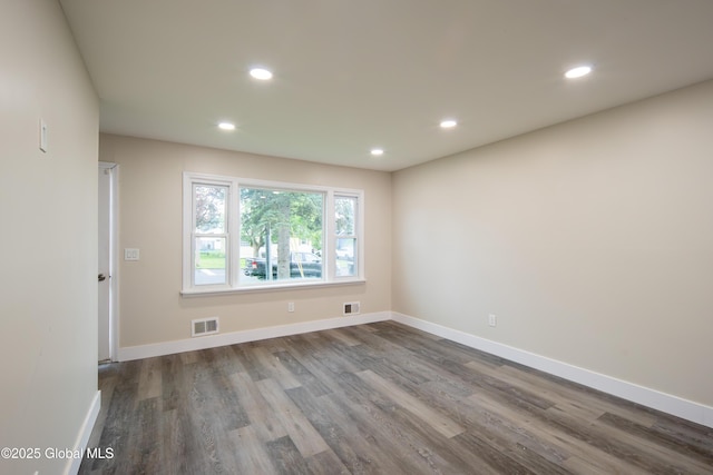 1041 Madison Ave, Troy, NY 12180 - empty room with dark wood-type flooring and recessed lighting